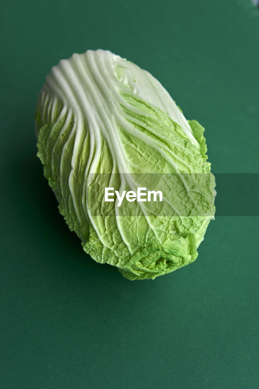 Close-up of cabbage against green background