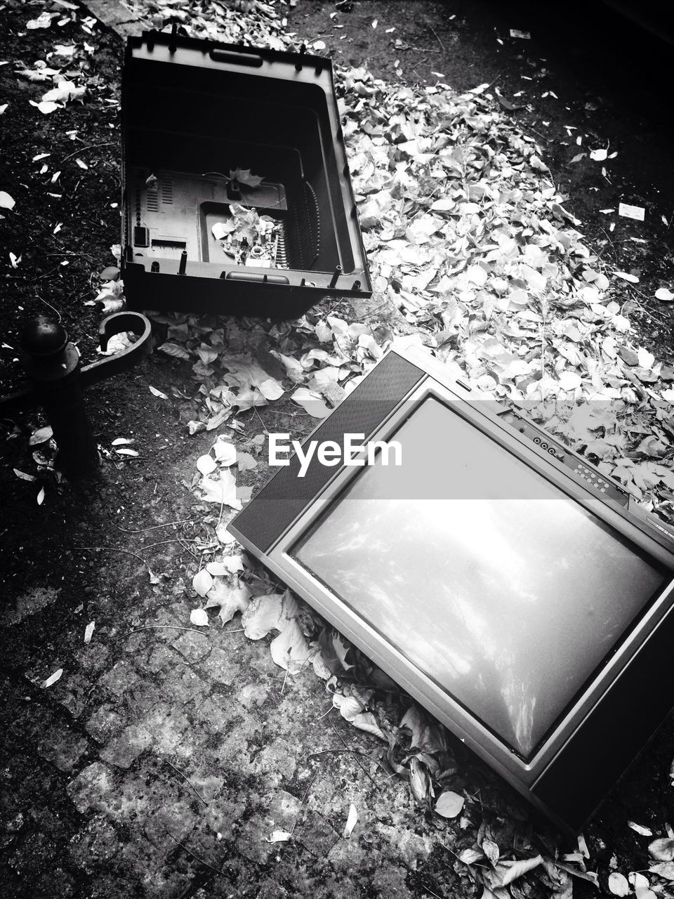 Broken television on ground