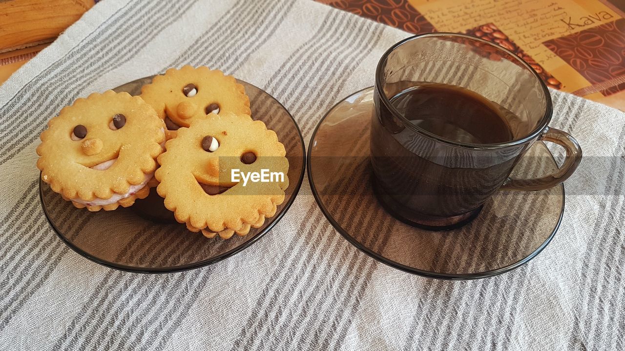food and drink, food, sweet food, baked, freshness, table, dessert, sweet, wood, high angle view, indoors, drink, no people, still life, cup, mug, cake, temptation, refreshment, cookie, coffee, icing, chocolate, snack, plate, close-up, tea, hot drink, unhealthy eating