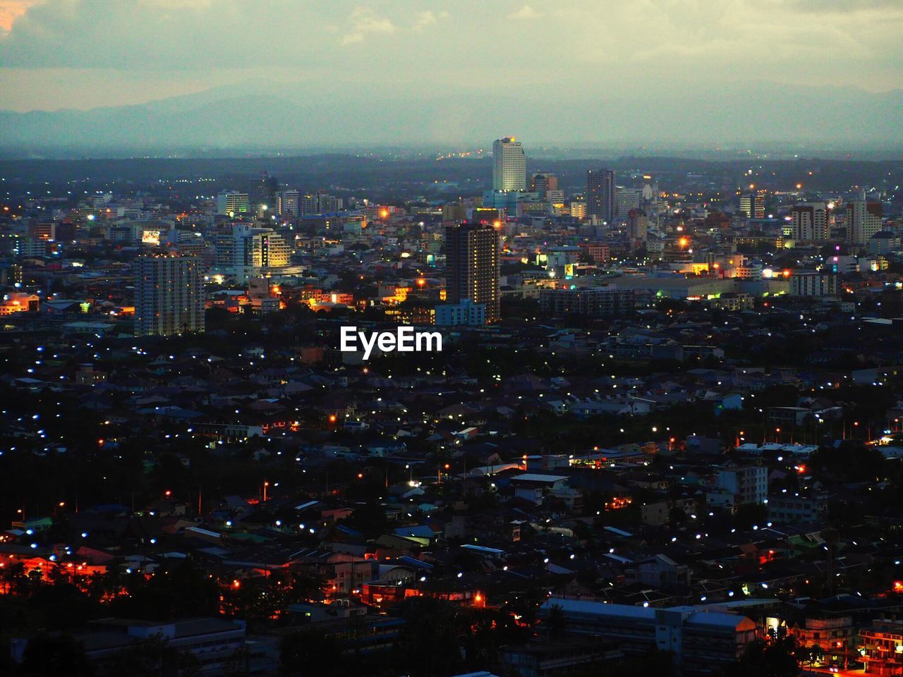 AERIAL VIEW OF ILLUMINATED CITY AT NIGHT