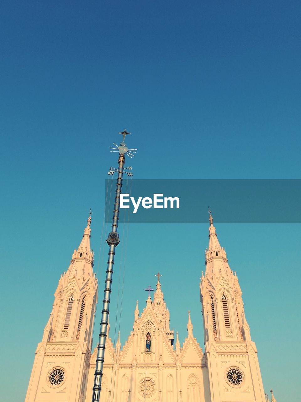 Low angle view of church against blue sky