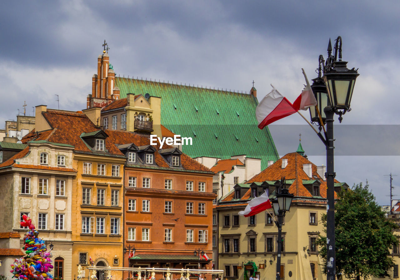 low angle view of buildings in city against sky