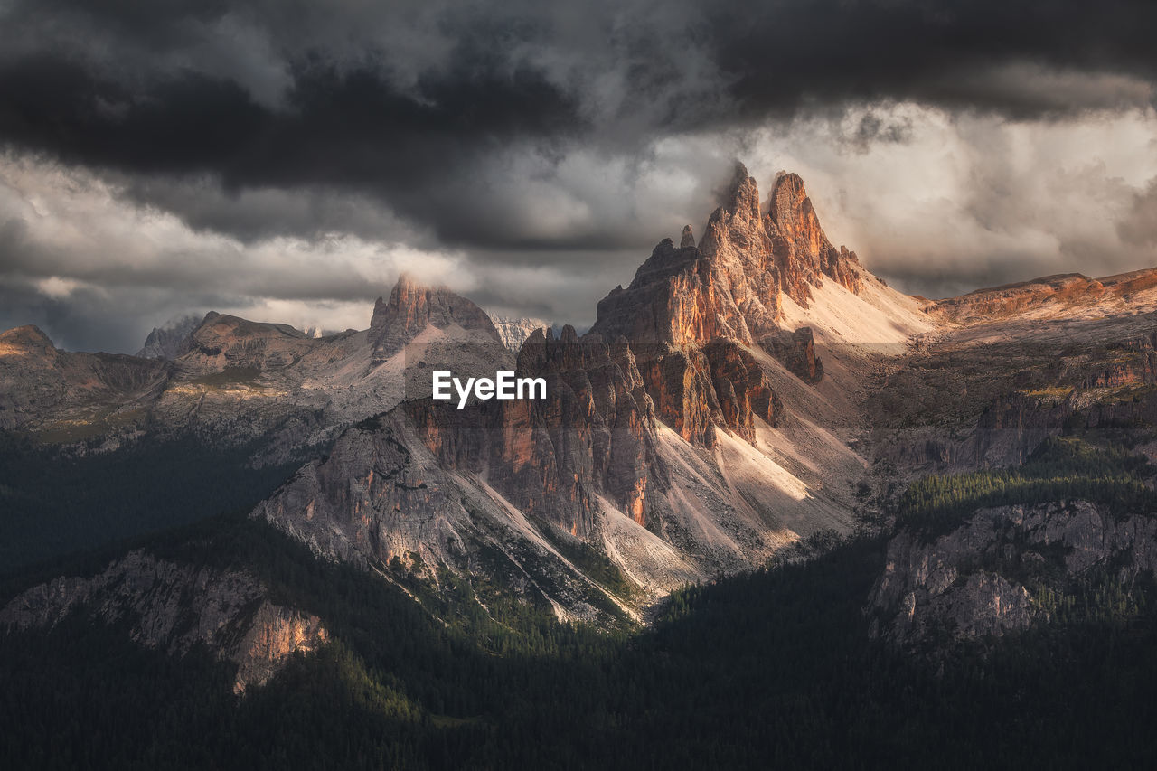 Moody landscape with dolomite mountains in perfect sunset light.