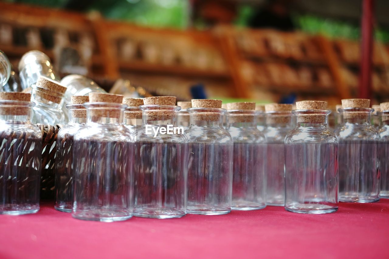 Close-up of glass jars arranged on table