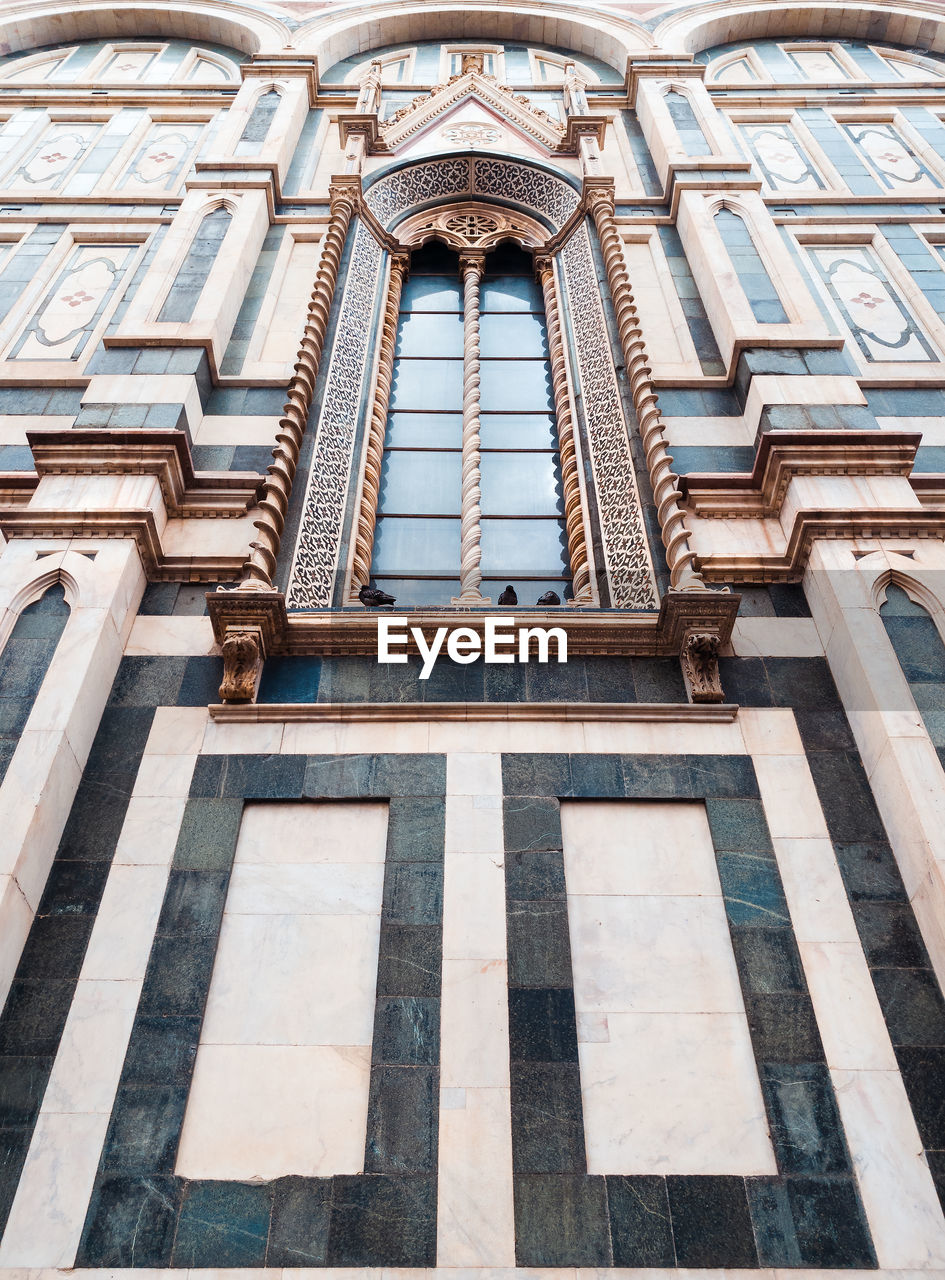 Low angle view of ornate building santa maria novella in florence 