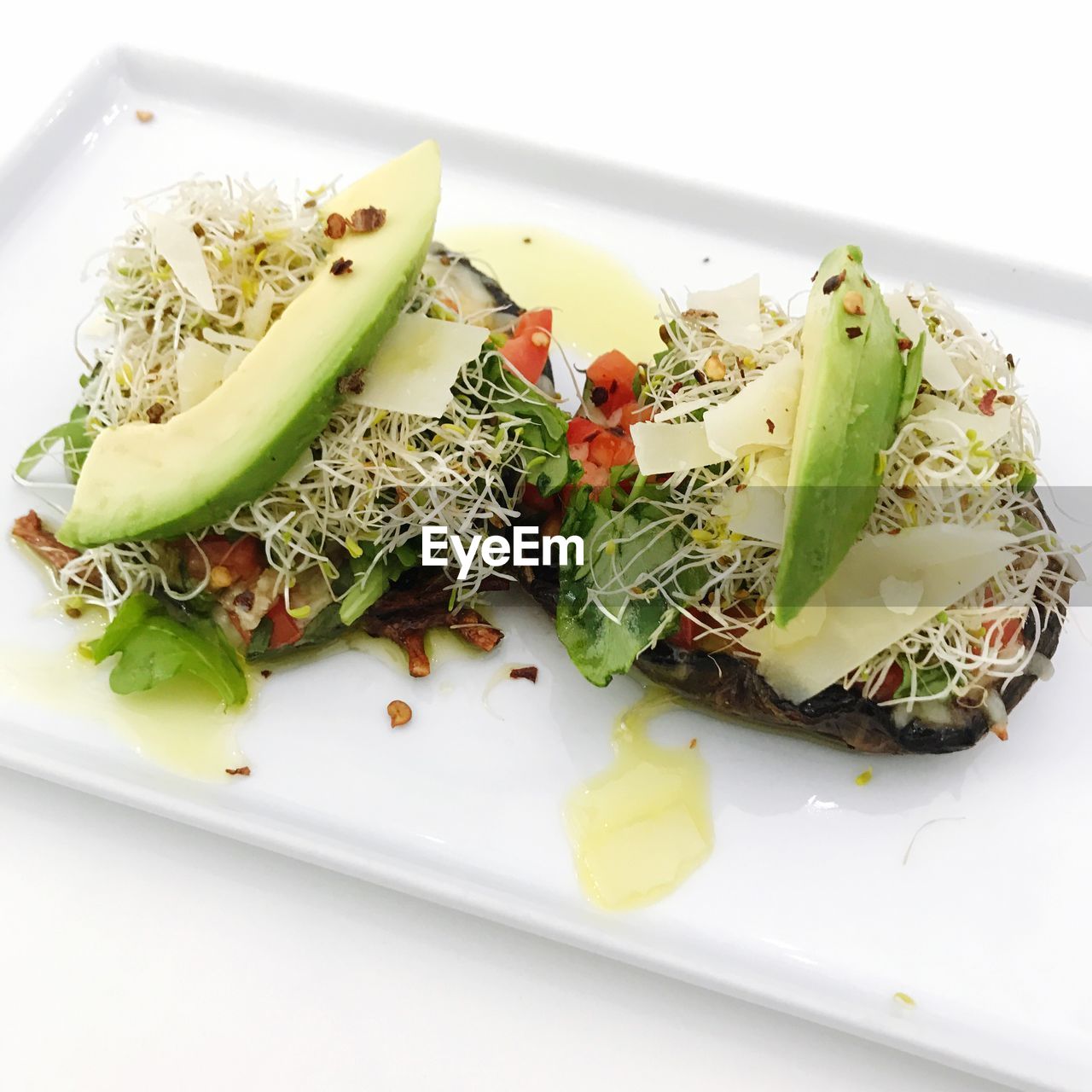 High angle view of food served in plate on white background