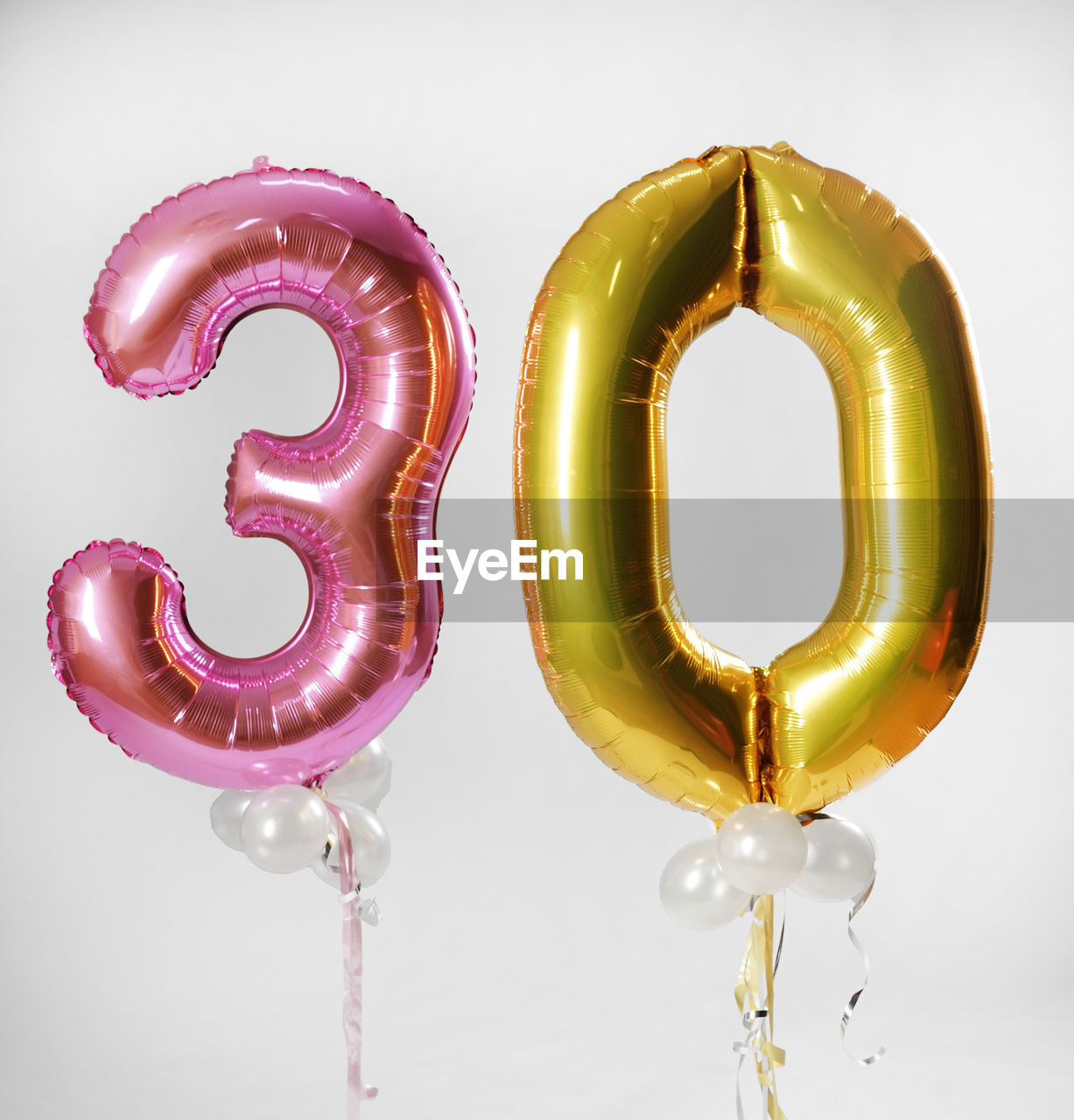 Balloons in shape of numbers against white background