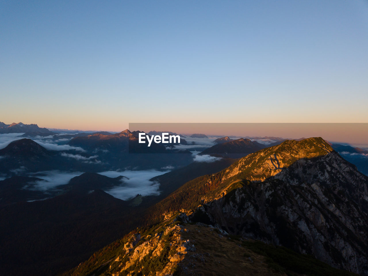 SCENIC VIEW OF MOUNTAINS AGAINST SKY DURING SUNSET