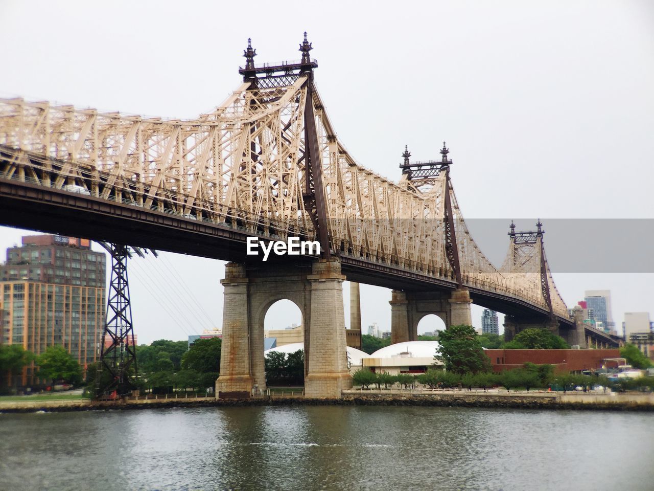 Low angle view of queensboro bridge seen from sutton place park