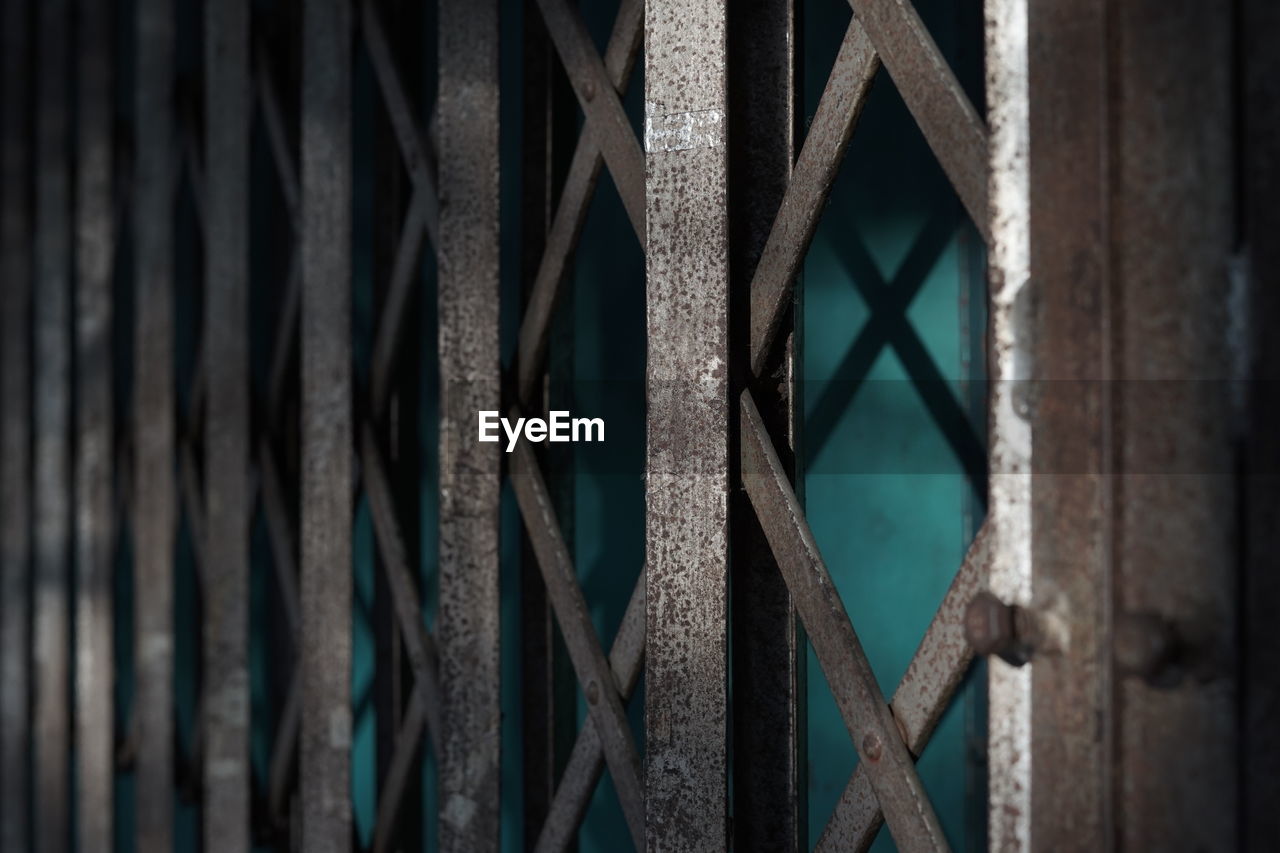full frame shot of metal gate