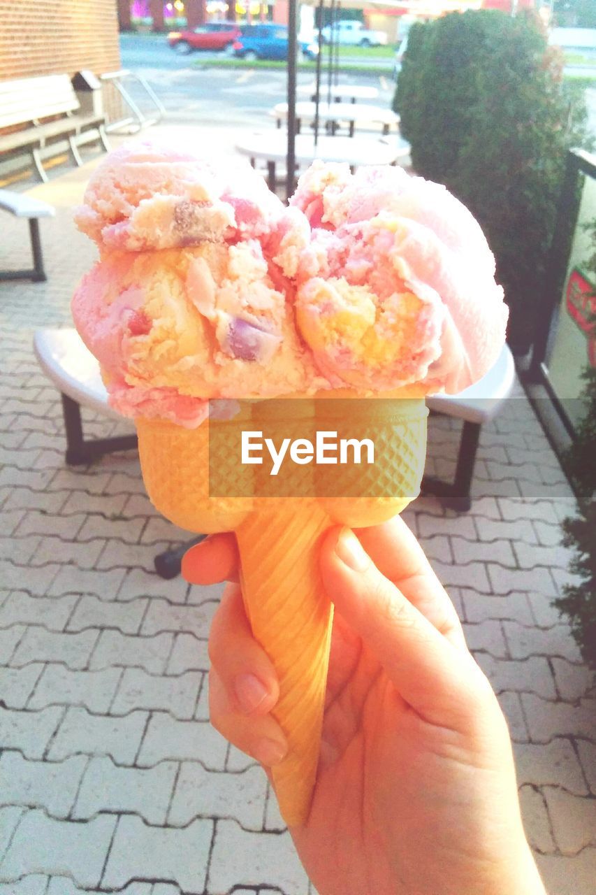 Cropped hand of person holding ice cream