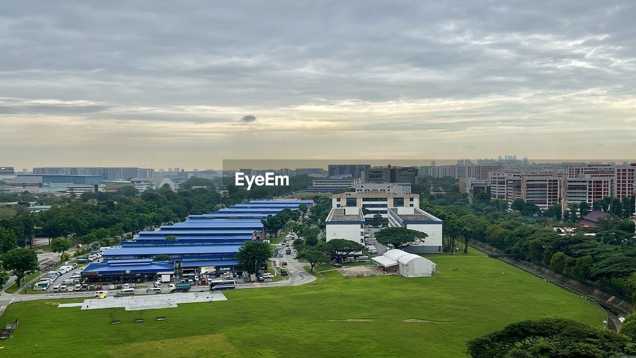 architecture, built structure, building exterior, city, building, sky, aerial photography, high angle view, cityscape, nature, cloud, skyline, landscape, residential district, urban area, environment, residential area, bird's-eye view, plant, travel destinations, travel, outdoors, urban skyline, grass, business finance and industry, aerial view, sport venue, construction industry, no people, landmark, sunset, office building exterior, sports, tree, tourism, stadium, house, transportation, horizon, street, city life, tower block, skyscraper, day, water