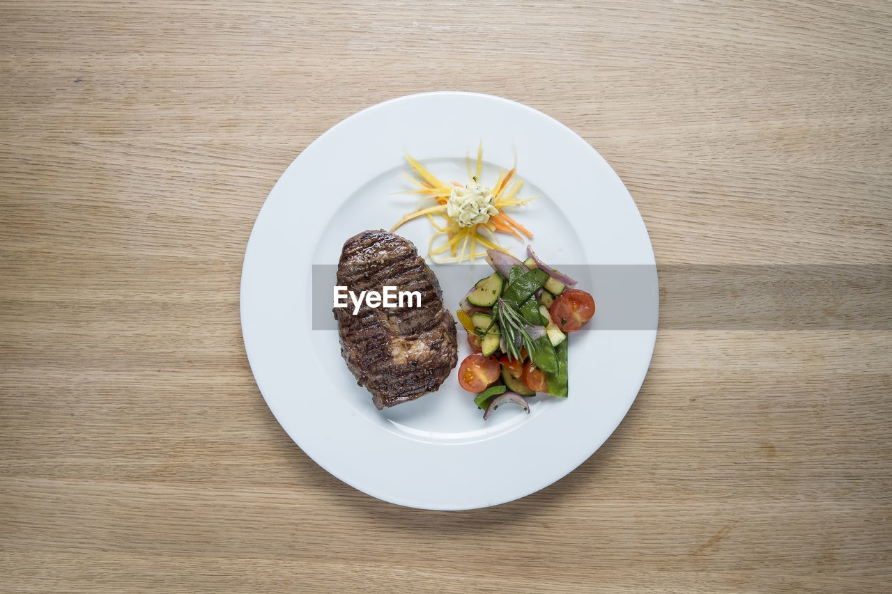 HIGH ANGLE VIEW OF SALAD SERVED ON TABLE