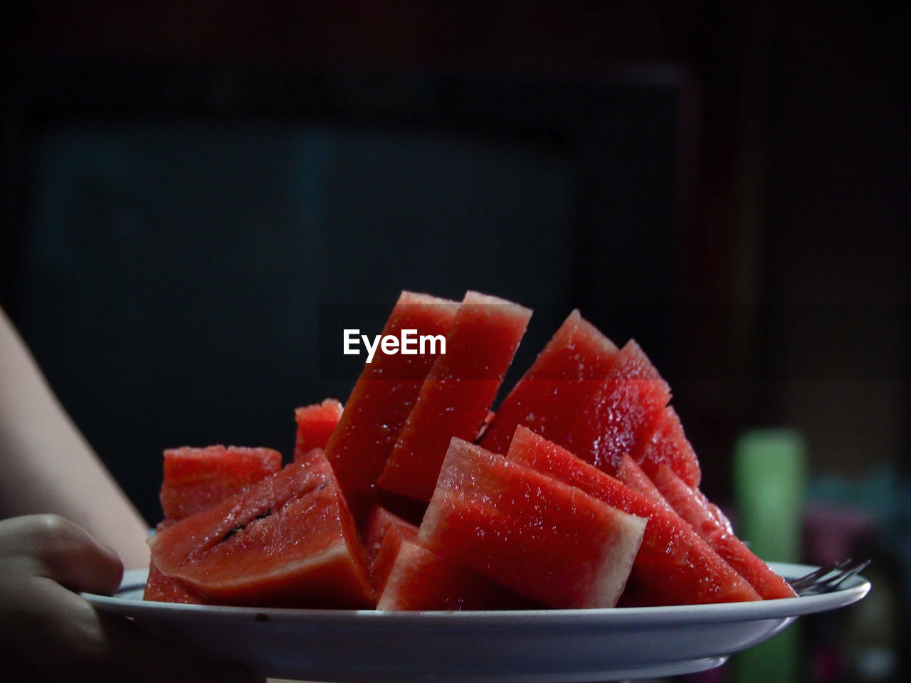 Close-up of chopped fruits in bowl on table