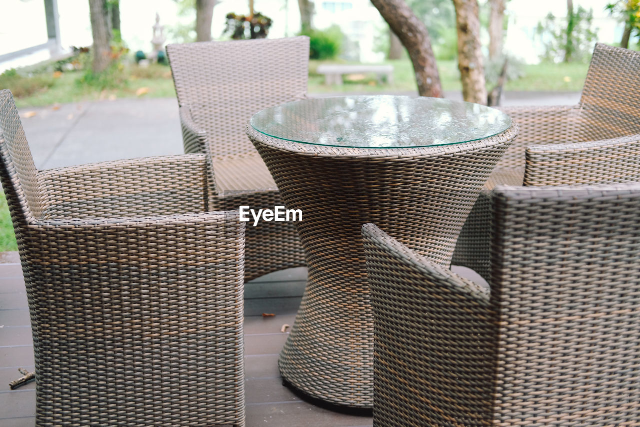 CLOSE-UP OF CHAIRS ON TABLE