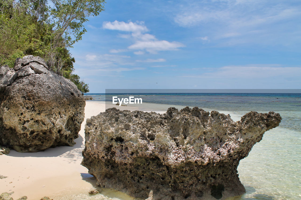 Large limestone rocks on beautiful tropical beach