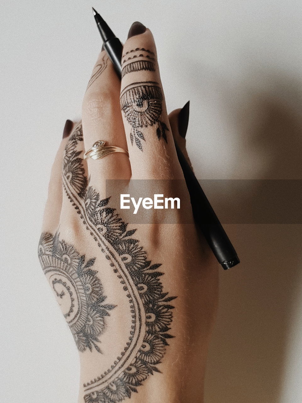 Close-up of woman hand with henna tattoo