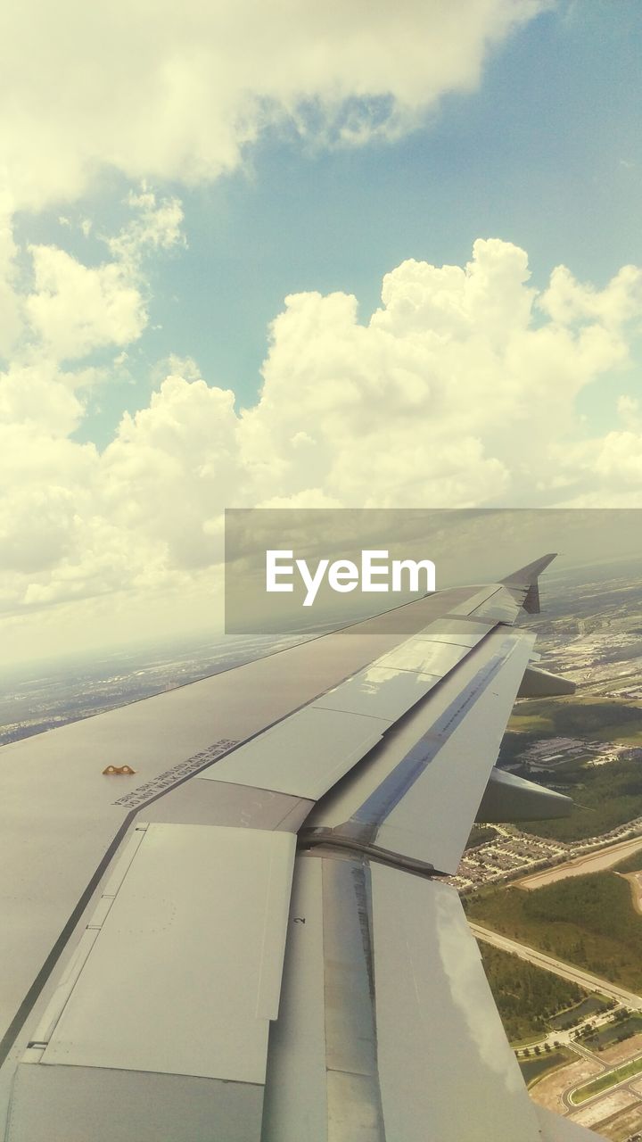 CROPPED IMAGE OF AIRPLANE WING