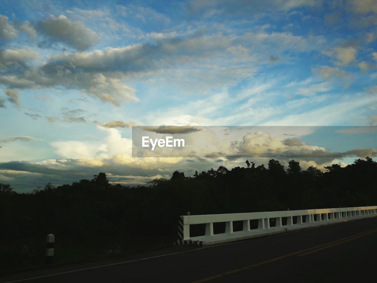 ROAD AGAINST SKY AT SUNSET