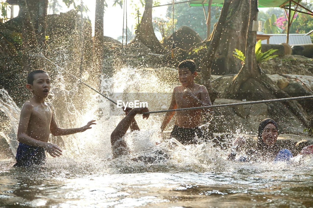 Woman jumping in water