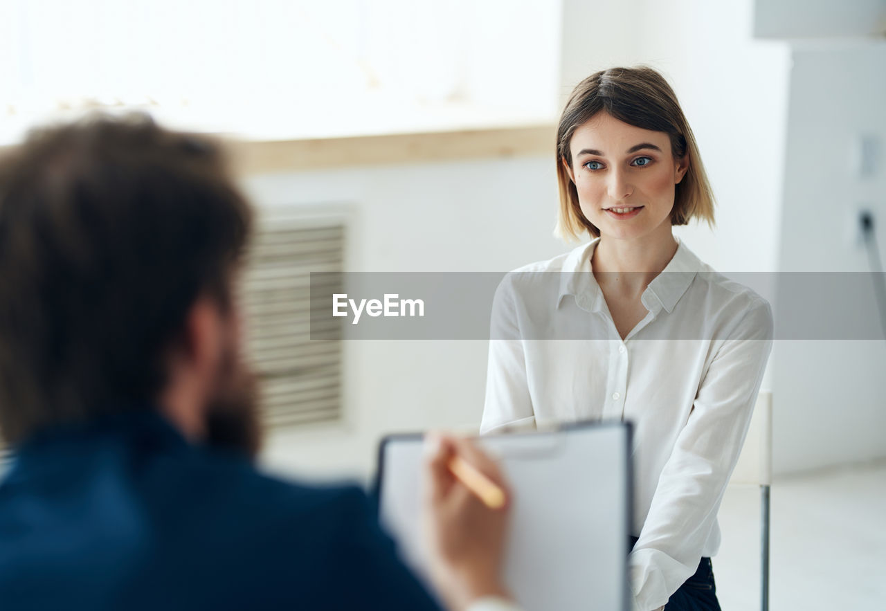 Woman sitting at job interview