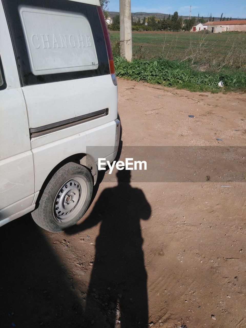 PERSON STANDING ON ROAD