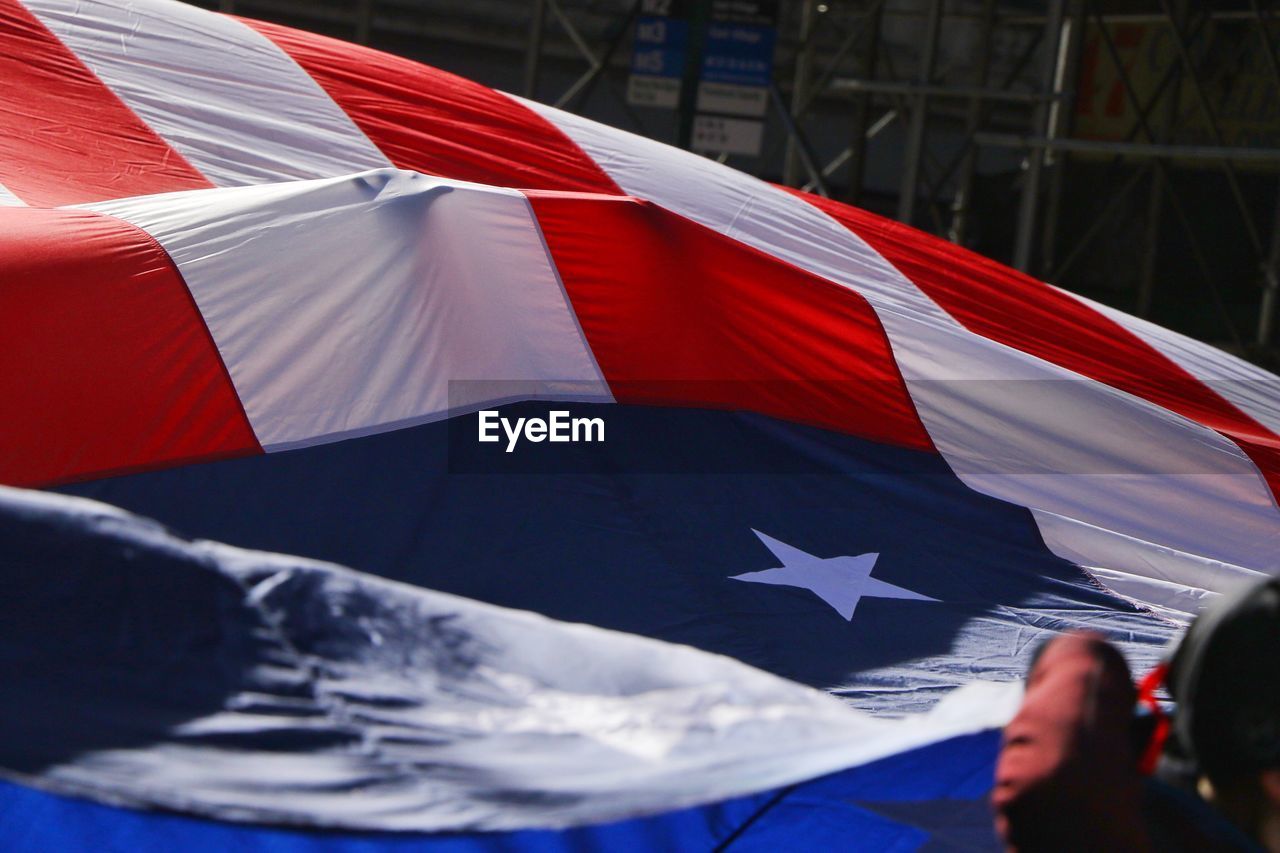 Hand holding cuban flag