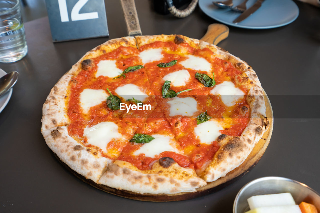 High angle view of pizza on table in restaurant