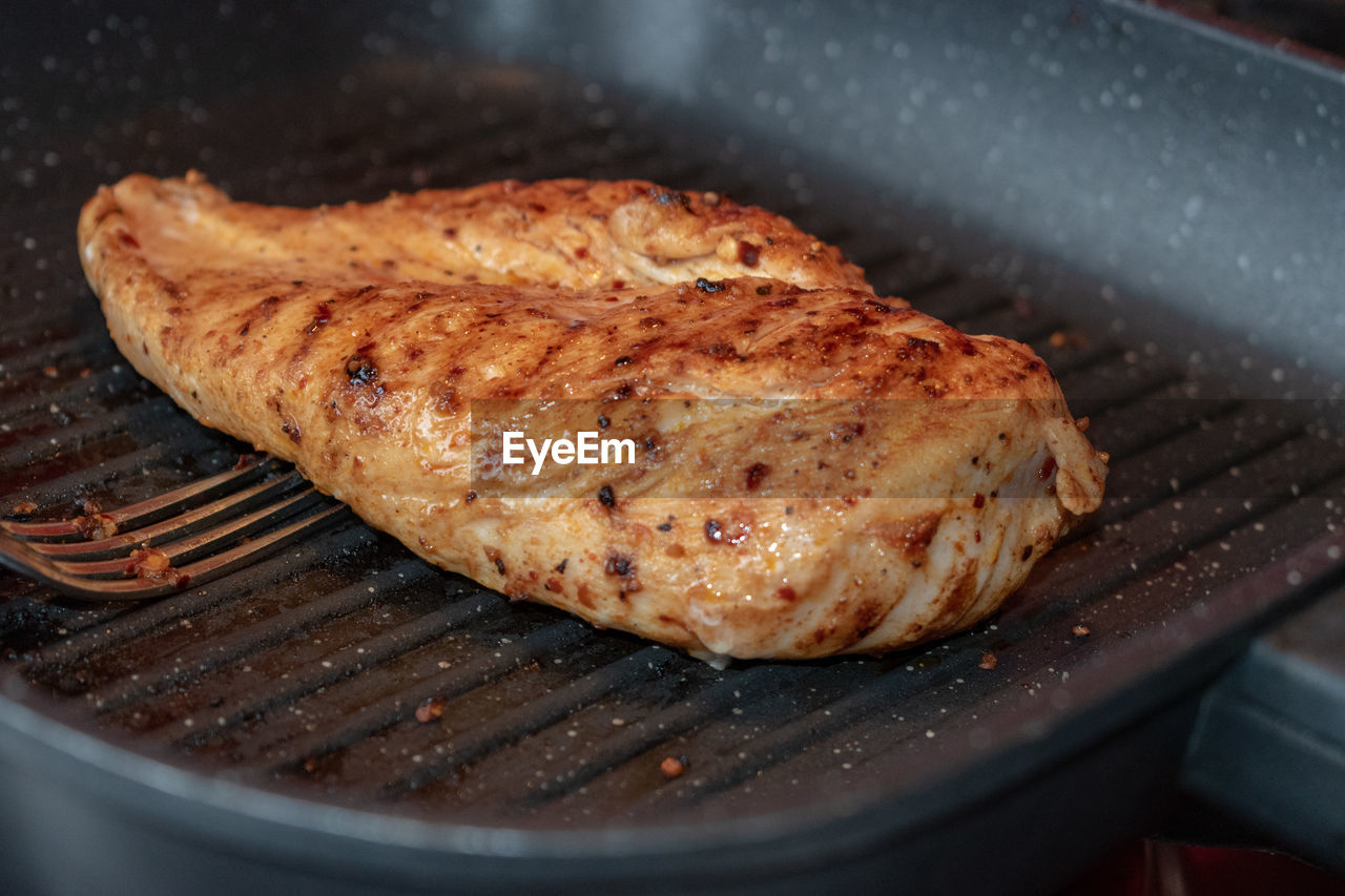 High angle view of meat on barbecue grill