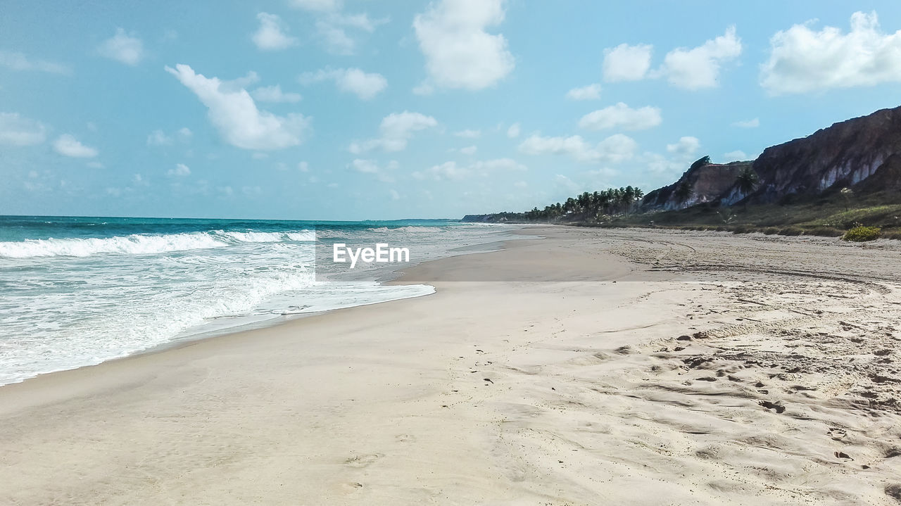 Coast of a beach in brazil with ocean sky and sand