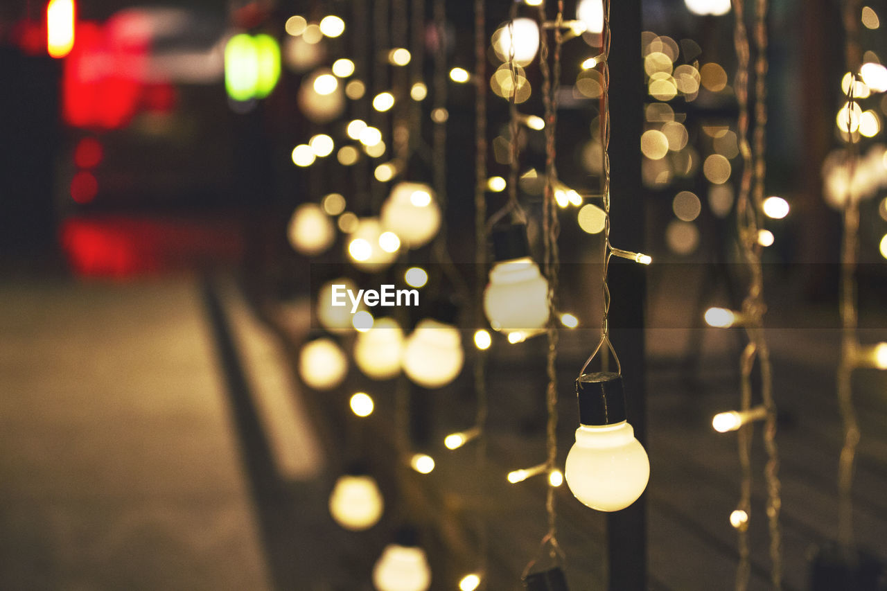 Illuminated decoration hanging at night