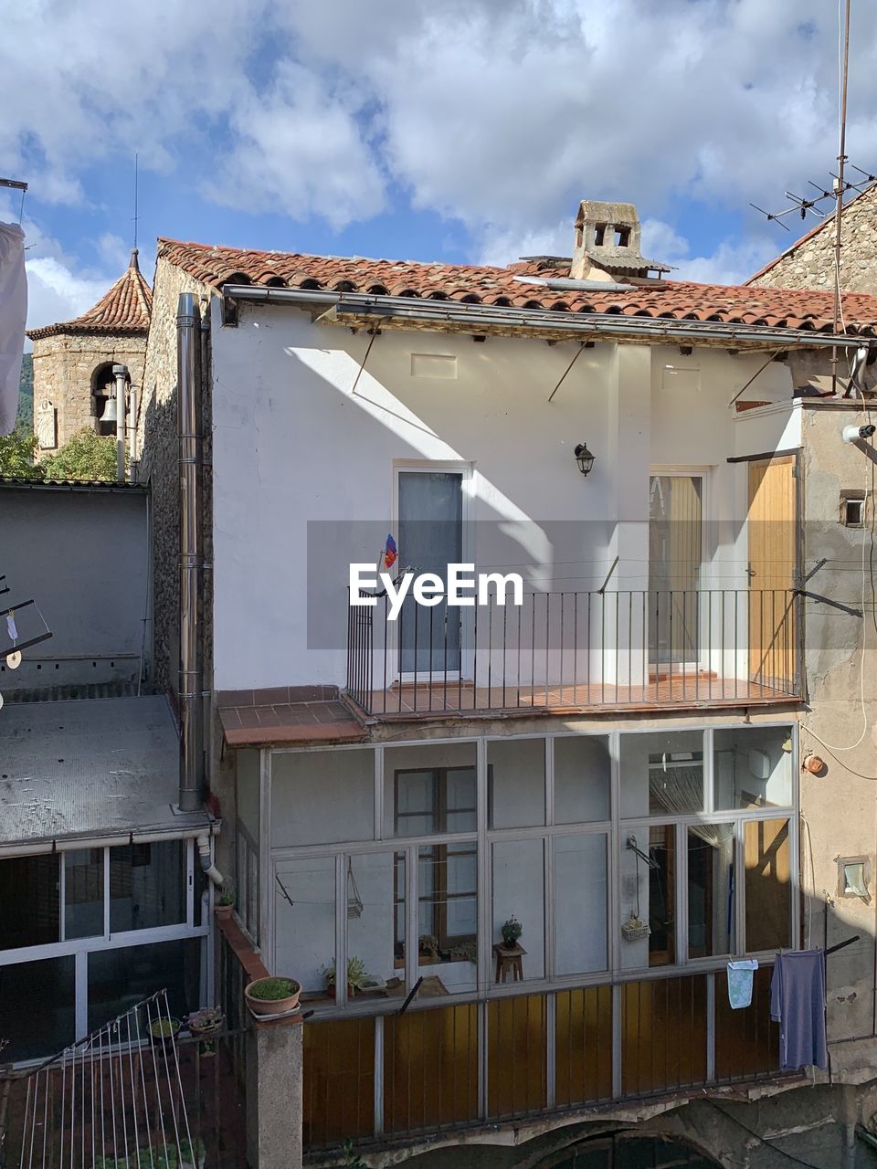 Exterior of houses in town against sky