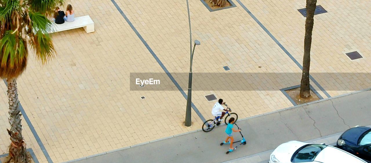 High angle view of woman riding bicycle