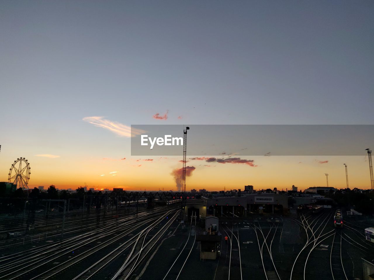 High angle view of railroad tracks against sky during sunset