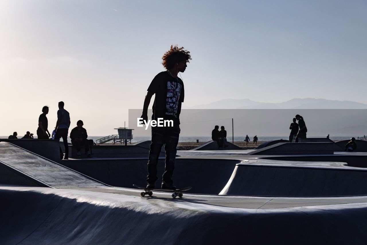 PEOPLE ON SKATEBOARD IN PARK