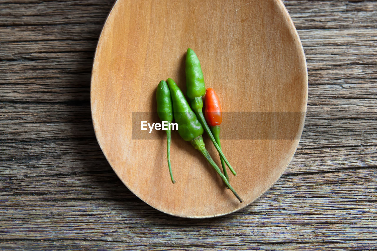 High angle view of chili peppers on table
