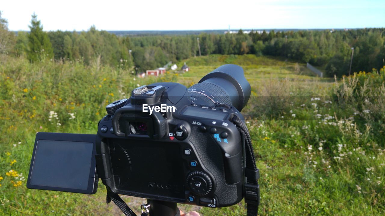 VINTAGE CAMERA ON FIELD