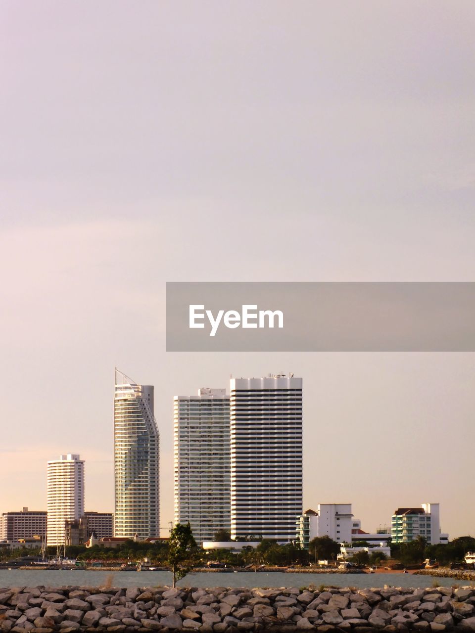 Modern buildings in city against clear sky