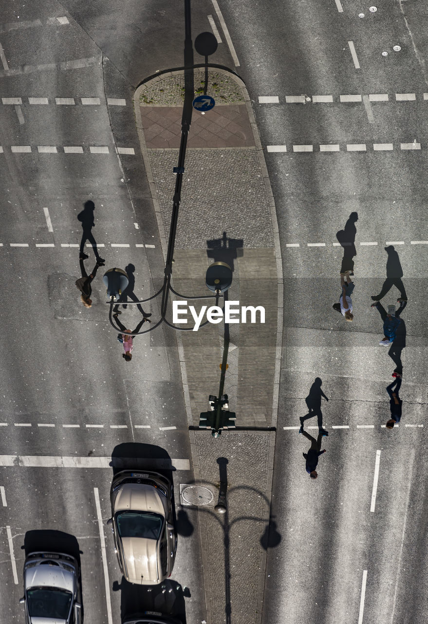 High angle view of people walking on street in city
