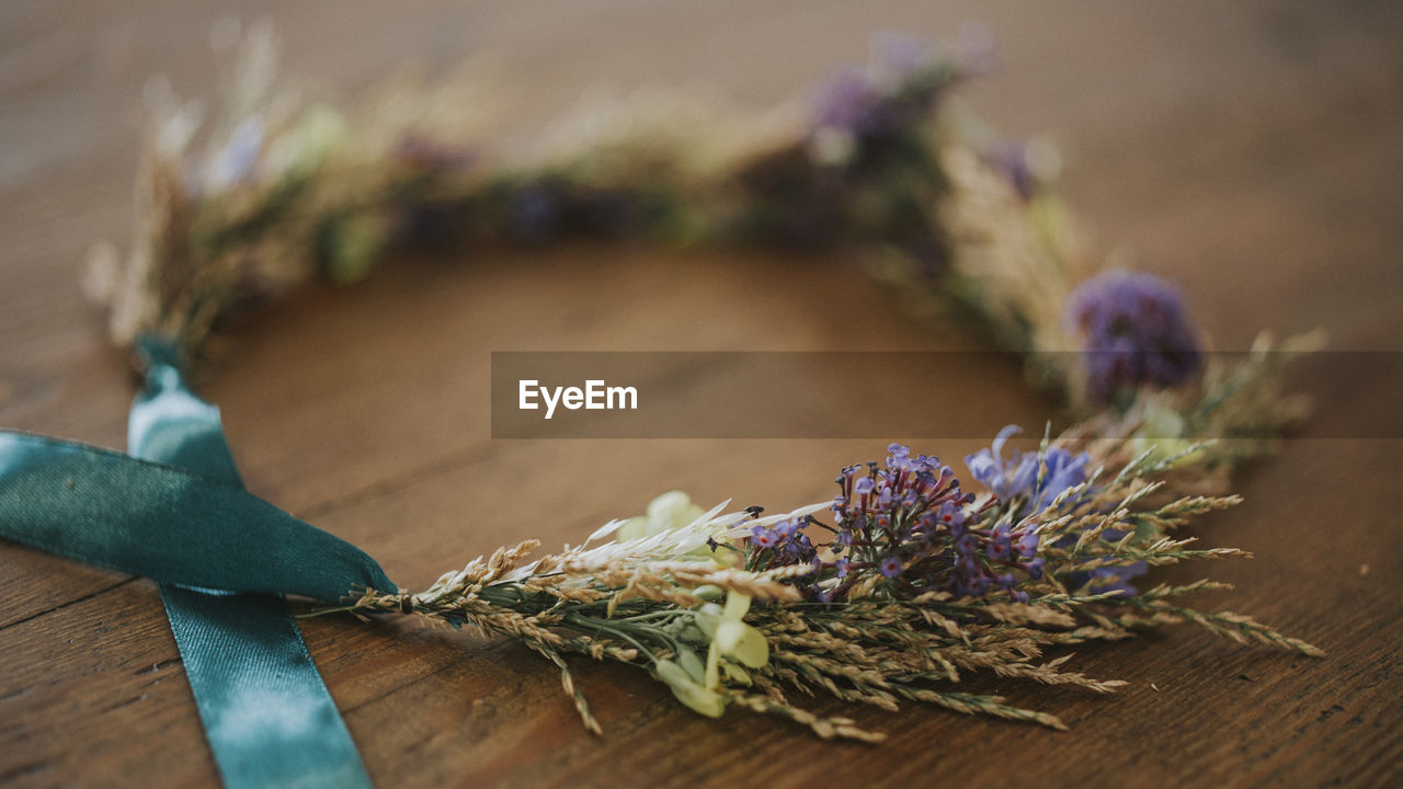 Close-up of wreath on wooden table
