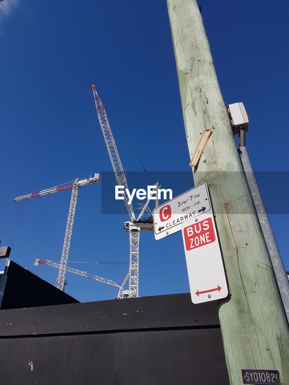 LOW ANGLE VIEW OF INFORMATION SIGN