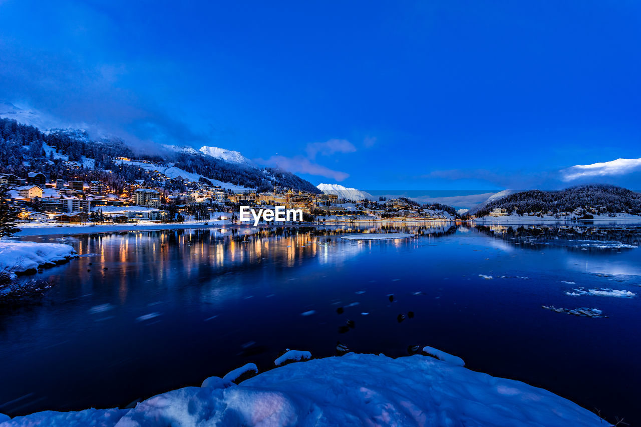 View of beautiful night lights of st. moritz town in switzerland at night in winter