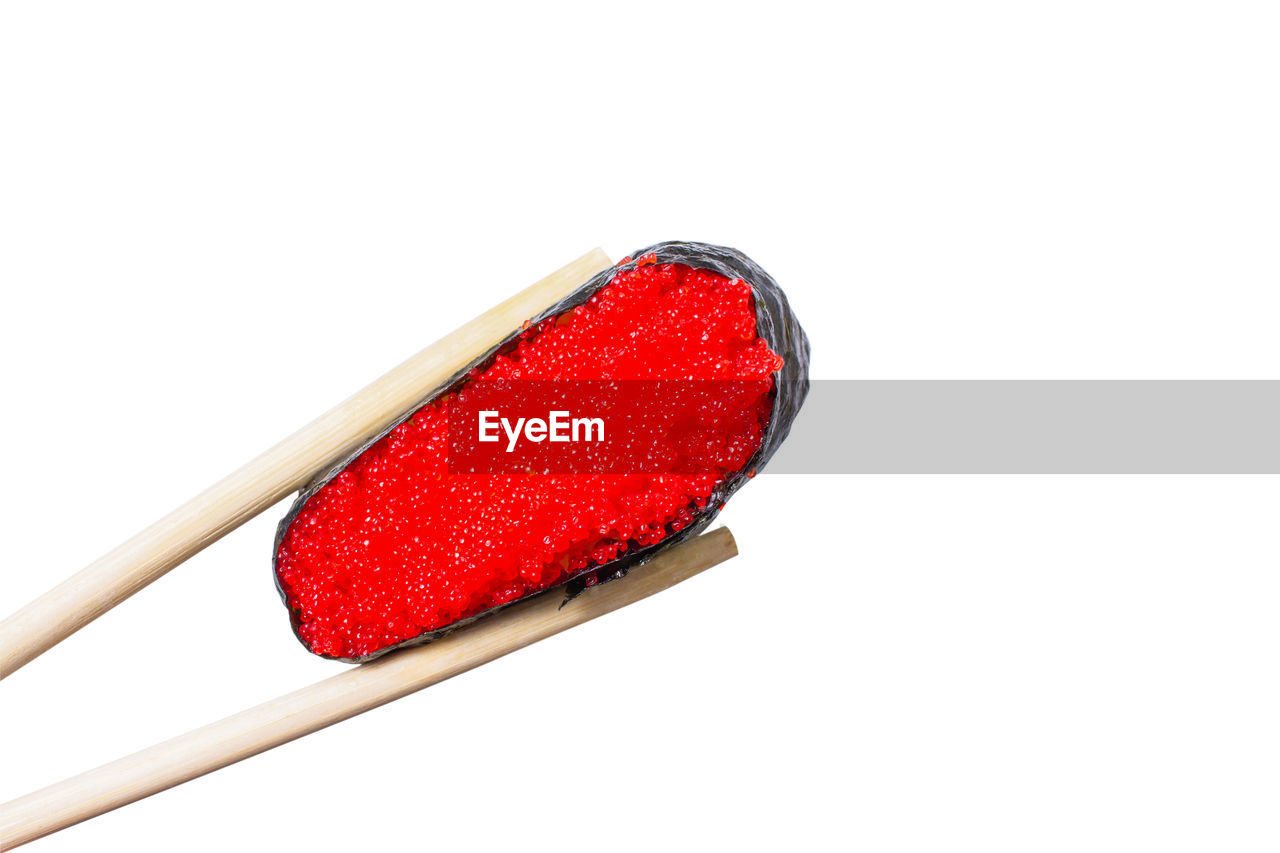 HIGH ANGLE VIEW OF RED STRAWBERRY OVER WHITE BACKGROUND