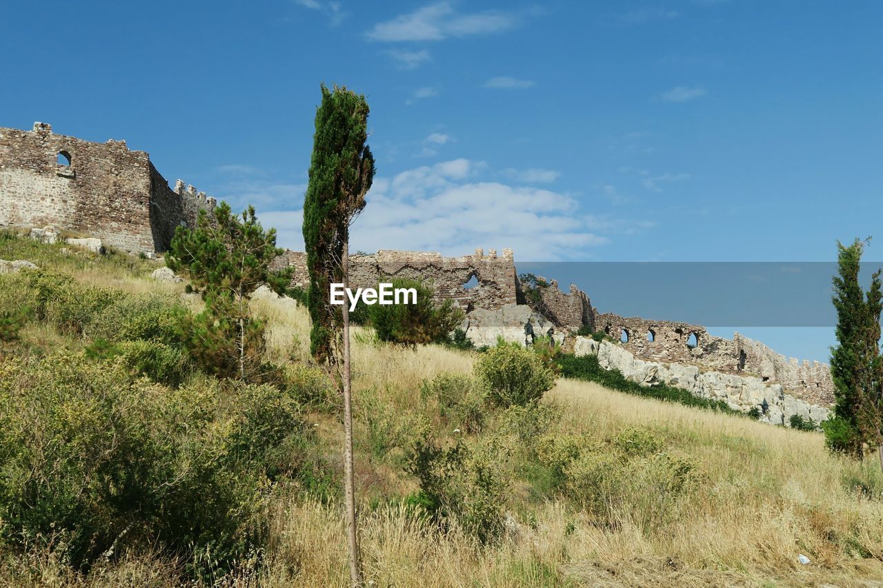 Surrounding wall of mytilene castle against sky