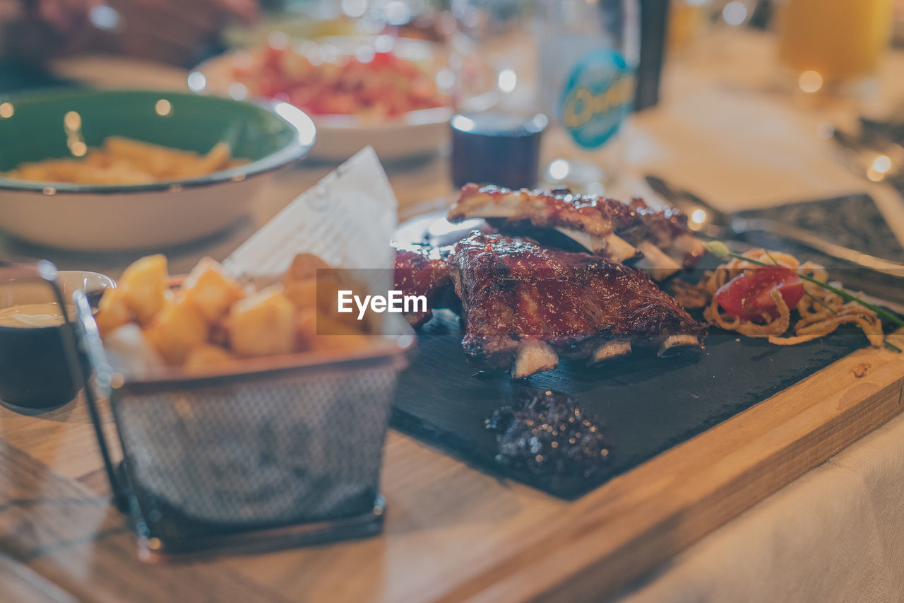 CLOSE-UP OF FOOD SERVED ON TABLE