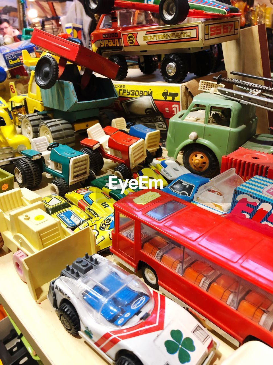 HIGH ANGLE VIEW OF TOY CAR AT MARKET