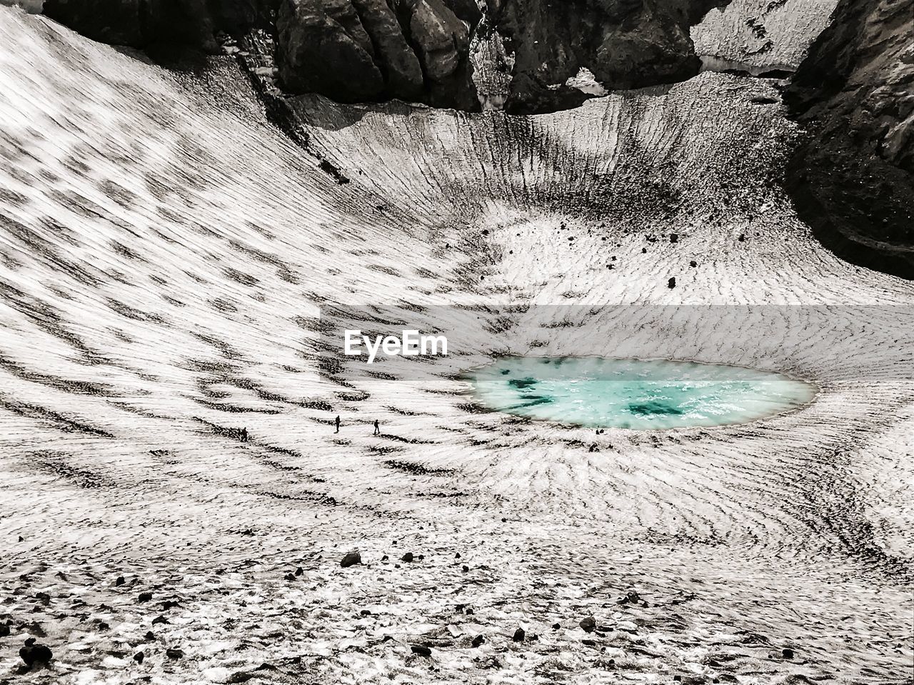 High angle view of lake amidst rocks