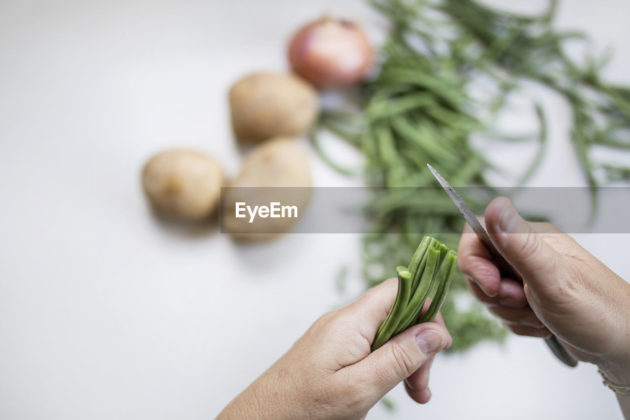 Close-up of hand holding vegetables