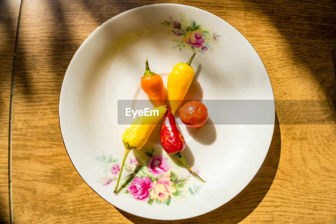 directly above shot of fruits in plate on table