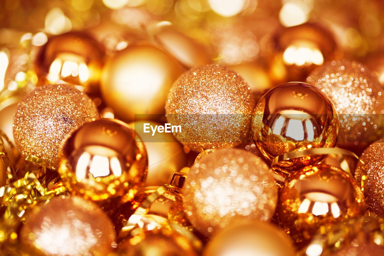 Full frame shot of golden baubles